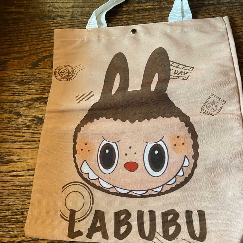 Tan Labubu Tote Bag. 
BUY ONE GET ONE FREE